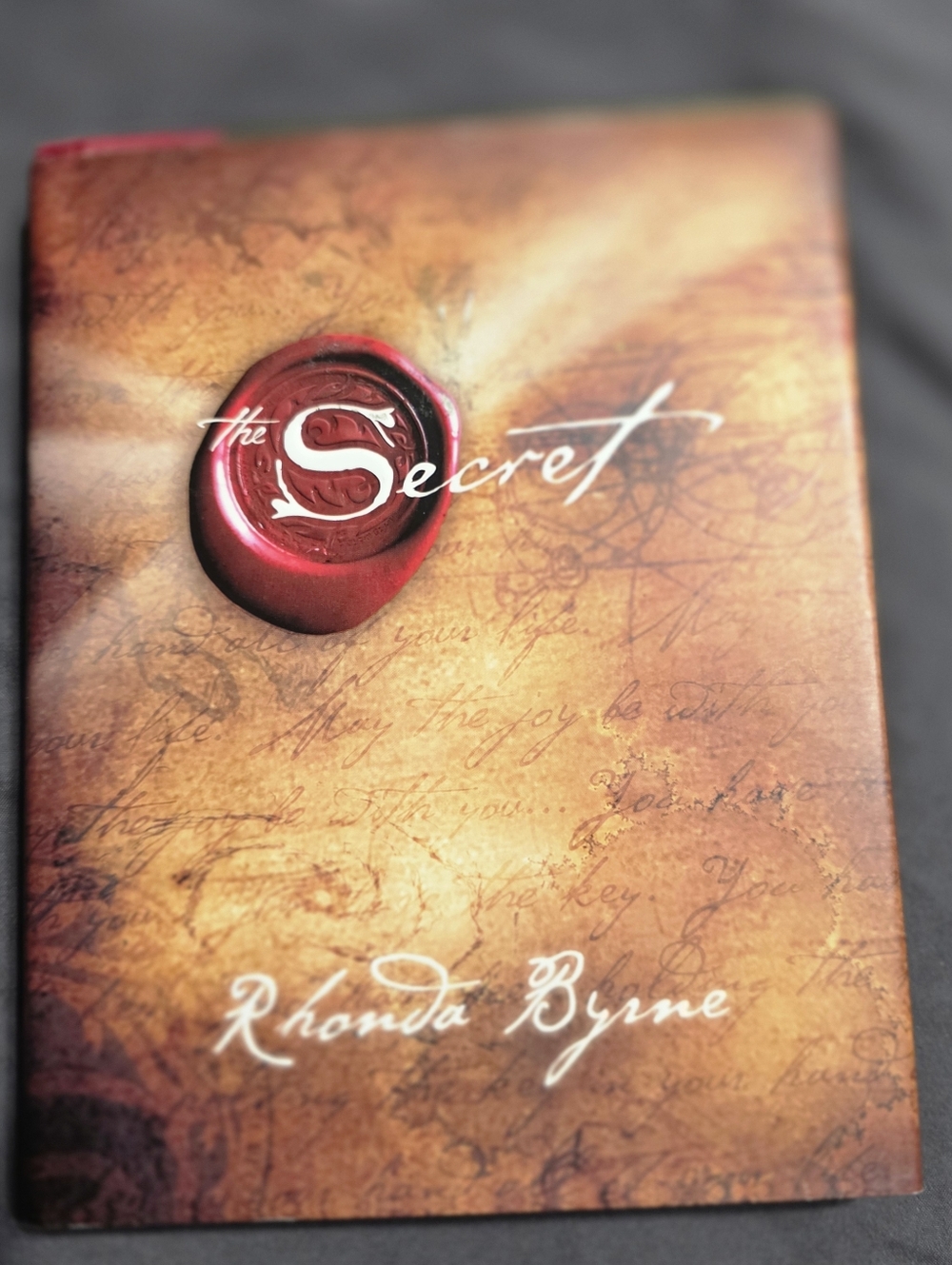 The Secret by Rhonda Byrne — Brown & Red Hardcover